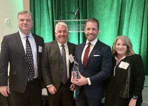 Casey Cathcart receives award on behalf of Cathcart Rail